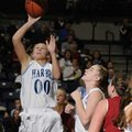 Springdale Har-Ber’s Halee Castleman, left, shoots during the Lady Wildcats’ 55-44 win over Springda...