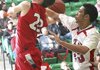 Cabot’s Darin Jones (22, top) has his shot blocked by Fort Smith Northside’s Ian Carter in Northside’s 44-31 victory.