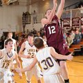 Lincoln’s Zach Turner, right, takes a shot in the lane over Lavaca’s Josh Atkins during the first ha...