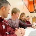 STAFF PHOTO DAVID FRANK DEMPSEY 
Gravette senior Tanner Daniels signs in the school’s gymnasium to ...