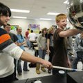 STAFF PHOTO SARAH BENTHAM 
William Lewis, left, University of Arkansas physics student, watches Cod...