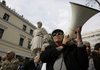 Greek pensioners protest government austerity measures Wednesday outside Athens’ municipal building in front of a statue of Pericles, the ancient statesman of Greece’s Golden Age.