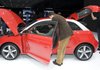  Visitors inspect a new Audi A1 on Wednesday at the Geneva Motor Show in Geneva. The show attracted about 250 exhibitors from 30 countries.