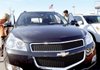 Don and Joann Ganim of Hamilton, Mass., look at a Chevrolet Traverse in Danvers, Mass., in November. 