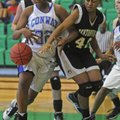 Bentonville’s Essence Baker, right, struggles for a rebound with Conway’s Krista Robinson on Thursda...