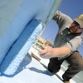 PAINT THE TOWN BLUE - Jimmy Walden, Bentonville Parks and Recreation Department crew leader, gives t...