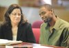 Johnny Ray Balentine, right, of Springdale smiles Tuesday alongside one of his attorneys, Leanna Houston, after being found not guilty of battering a Springdale police officer during an incident last year.