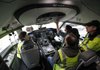 Technicians work in the first Boeing 787 to have its interior installed at the Everett, Wash., production plant in February.