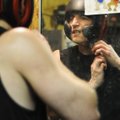 Abdenour tightens his helmet before getting in the ring to spar.