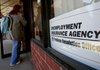 A job seeker enters Michigan’s Unemployment Insurance Agency Problem Resolution Offices on Friday in Livonia.