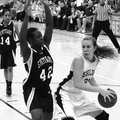 Shiloh Christian’s Lindsey Roe looks to score inside against Stuttgart’s Raven Sims during the first...