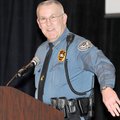 APPRECIATION LUNCH - Campus patrolman Steve Tosh speaks Friday at the annual NorthWest Arkansas Comm...