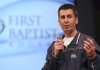 Dr. Adam Maass speaks Sunday to the congregation of First Baptist Church in Rogers about his experiences helping the earthquake victims in Haiti.
