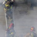 HOUSE FIRE - Firefighters with Northeast Benton County Fire Department work Friday to ventilate a ho...