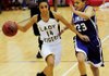 Prairie Grove’s Julie Rutherford, left, drives around Lonoke’s Cara Neighbors during the first half of the Class 4A State Tournament semifinal Saturday in Highland.