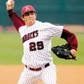 Arkansas freshman DJ Baxendale delivers a pitch during the Razorbacks’ Feb. 23 game against Ball Sta...