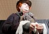Eric Burton bandages his thumb Saturday for his role as the Mad Hatter at the Arkansas Anime Festival at the Clarion Hotel in Bentonville.