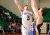 Fayetteville guard Kikko Haydar, left, shoots over North Little Rock’s Mike Evans in the second half of the Class 7A State Tournament semifinals on Saturday in Clair Bates Arena in Van Buren. Haydar had 24 points in the Bulldogs’ 49-41 victory. 