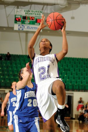 Fayetteville forward Sydney Conley goes for a layup in front of Bryant’s Brooke Parish in the second half of Fayetteville’s 73-45 win Saturday during the Class 7A State Tournament in Clair Bates Arena in Van Buren.