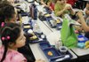 Students at Washington Elementary School eat lunch Friday in Fayetteville.