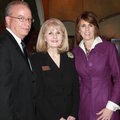 Hostess Elise Mitchell, from right, stands with Fayetteville Public Schools Superintendent Vicki and...
