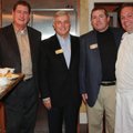 Chef Miles James, from right, visits with education foundation board members Bruce Armstrong, Greg L...