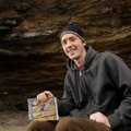 Cole Fennel, who turns 24 today, holds a copy of his book, “Rock Climbing Arkansas: Comprehensive Ro...