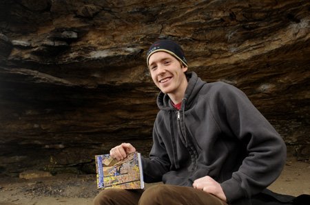 
                               
                                  Photo by Anthony Reyes&mdash;
                               
                           
                           Cole Fennel, who turns 24 today, holds a copy of his book, “Rock Climbing Arkansas: Comprehensive Roped Climbing and Select Bouldering.” The 400-page guidebook took 18 months to research.