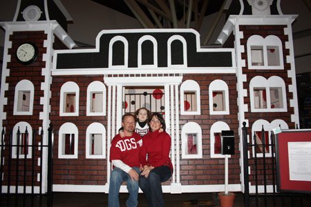
                               
                                  Photo by Carin Schoppmeyer&mdash;
                               
                           
                           John and Brandy Overton, with their daughter Sofia Overton, show the Old Main playhouse they built and donated to the Playhouse Palooza silent auction to benefit CASA. The auction will conclude at 5 p.m. Saturday at Northwest Arkansas Mall.
