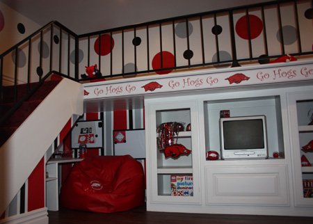 
                               
                                  Photo by Carin Schoppmeyer&mdash;
                               
                           
                           The Old Main playhouse is wired for television and cable, has a built-in desk with shelving, custom Razorback railing and custom entertainment center.