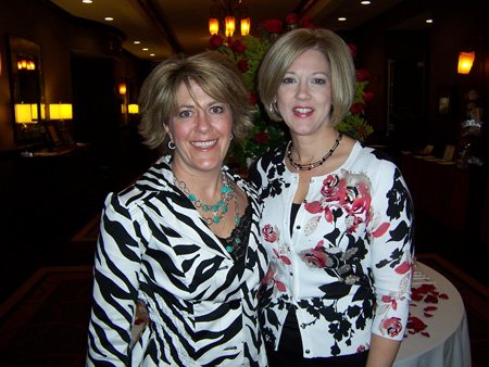 
                               
                                  Photo by Sarah Bentham&mdash;
                               
                           
                           Michelle McFadden, left, and Allison Brock, co-chairwomen of the third annual Northwest Arkansas Wine Opener, check final touches before the Feb. 26 event at the Doubletree Guest Suites in Bentonville.
