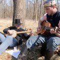 Chris Schafer left, and Sam Petersen sing a Civil War era song Saturday about primitive biscuits tit...