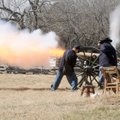 Members of the Northwest Arkansas Historical Association fire a canon Saturday near Elk Horn Tavern ...