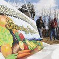 SHARED GROUND - Officials and residents break ground Saturday at the Springdale Community Garden on ...