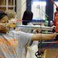 STAFF PHOTO ANTHONY REYES 
Kinna Laju, 14, aims her bow at a target during a physical education cla...