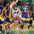 Fayetteville senior guard Taylor Cochran, center, drives the baseline around North Little Rock senio...