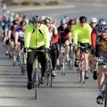 STAFF PHOTO ANDY SHUPE 
About 150 cyclists head south on South School Avenue in Fayetteville on Sun...