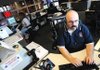STAFF PHOTO MARC F. HENNING 
Rogers police and fire dispatcher Joe Jacques takes a police emergency call Thursday at the Rogers Police Department. Jacques has been a dispatcher in Rogers since 1997.