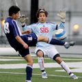 STAFF PHOTO J.S. WEDGEWORTH 
Springdale High goalie Jose Honesto, right, tries to block a shot from...