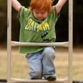  Arkansas Democrat-Gazette/WILLIAM MOORE
Rowan Shelby, 3, of Fayetteville climbs on a piece of play...