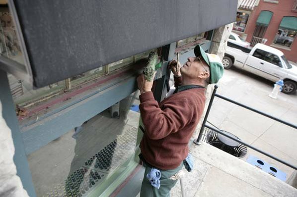 Chuck Decker washes the windows ...