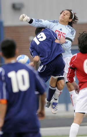 STAFF PHOTO J.S. WEDGEWORTH 
Springdale High goalkeeper Jose Honesto, right, gets tangled up with Springdale Har-Ber’s Jorge Gonzalez during the boys championship game of the NWA Showcase on Saturday at Rogers Heritage High School.