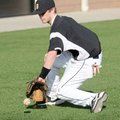 Bentonville shortstop Logan Pearson fields a ground ball during Tuesday’s practice near the Tiger At...