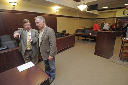 Judge James O. Cox, left, ...