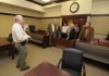 FIELD TRIP - Capt. Larry Burris, left, gives the Benton County justices of the peace a tour Tuesday of the Sebastian County Justice Center in Fort Smith. The justices and county judge Dave Bisbee toured the facility to see if a similar design would suit Benton County. Burris is a Sebastian County sheriff’s deputy and is the courthouse security supervisor.