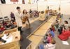 HISTORICAL NOTES - Actors, from left, Jason Suel, Jules Taylor and Christy Hall sing during a performance of “Digging Up Arkansas” for a group of third graders at Washington Elementary School in Fayetteville. The play, which explains Arkansas history, is a product of the SmART School Residency program in conjunction with Trike Theater, the Walton Arts Center and the Arkansas Arts Council.