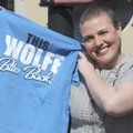 Cancer survivor Casey Wolfe poses with one of her “Casey’s Cancer Posse” team shirts on March 5 at F...