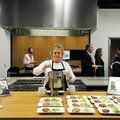 Lisa Clayton, Culinary Team Member with Tyson Foods, serves a bowl of Tomato Basil soup during a sam...