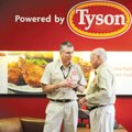 Tyson Foods CEO Donnie Smith, left, speaks with Don Tyson, right, at the Tyson Corporate office in S...