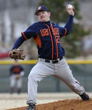 Rogers Heritage starter Travis Entwisle delivers a pitch during the War Eagles’ benefit game March 2 against Greenwood at Veterans Park in Rogers.